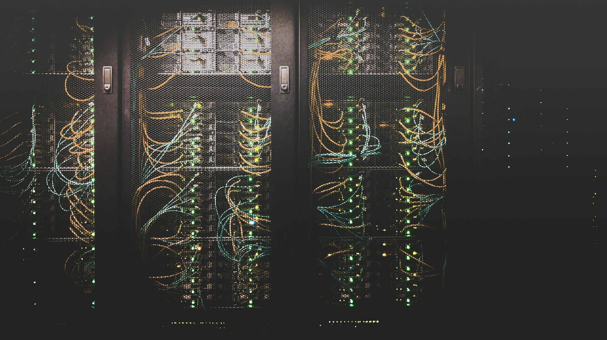 Server racks with structured cabling and status lights